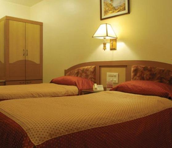 The Ambience Hotel Pune Værelse billede