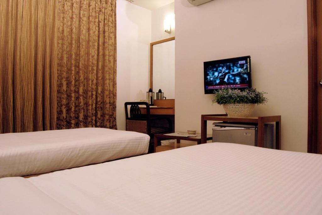 The Ambience Hotel Pune Værelse billede